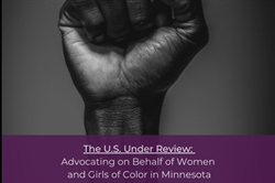 [ai] A raised fist against a dark background, symbolizing strength and solidarity, with a purple banner below reading "The U.S. Under Review: Advocating on Behalf of Women and Girls of Color in Minnesota."
